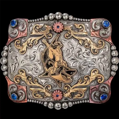 A custom women's belt buckle featuring a shark riding cowgirl figure 